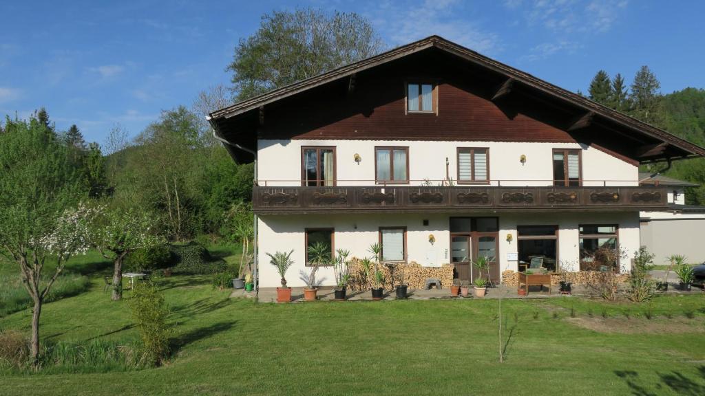 a large white house with a brown roof at Tildes Apartments in Reifnitz