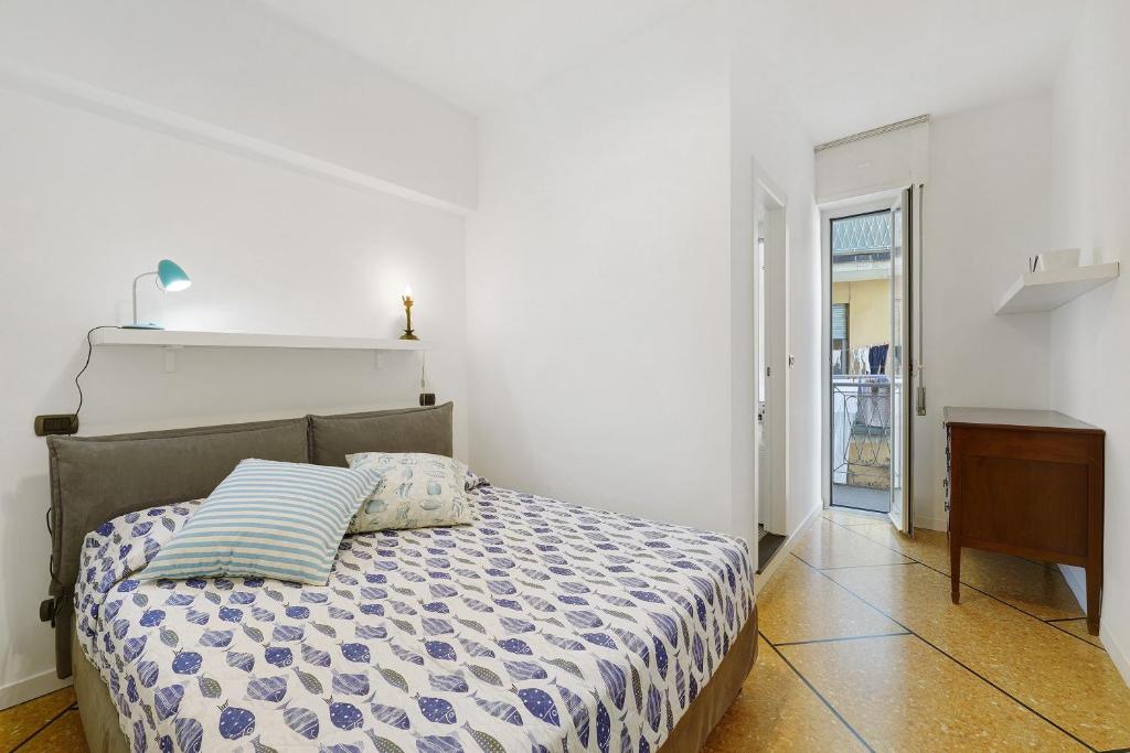 a bedroom with a bed with a pillow on it at Beautifulliguria in Sestri Levante
