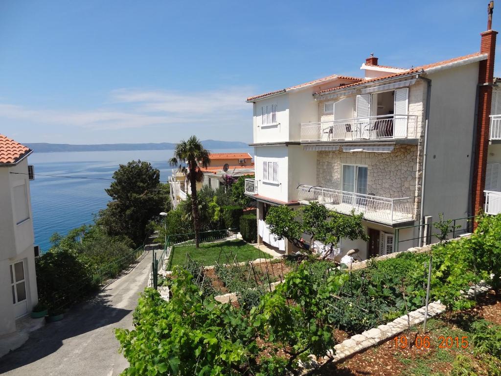 an apartment building with a view of the ocean at Apartments Klaricic in Živogošće