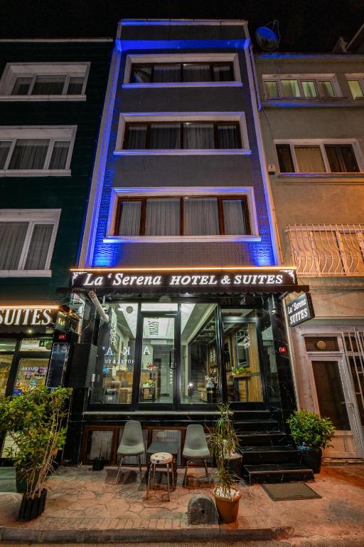 a store front of a hotel with chairs in front of it at La Serena Taksim in Istanbul