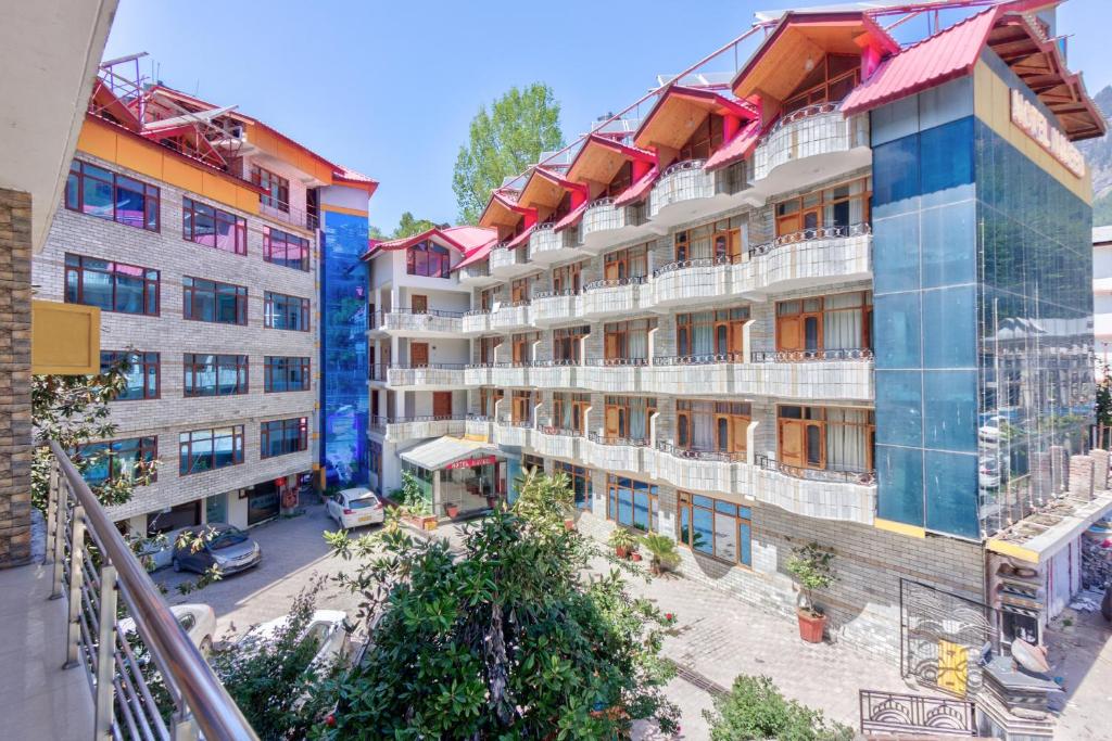 an aerial view of an apartment building at Hotel Naveen Manali in Manāli