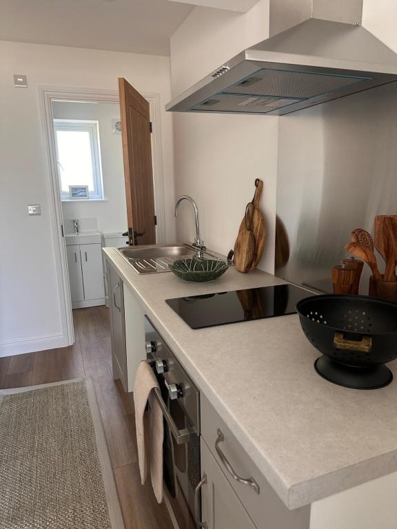 a kitchen with a sink and a counter top at Dalforth in Takeley