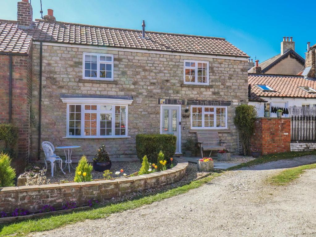 a brick house with a table in front of it at Mill View in York