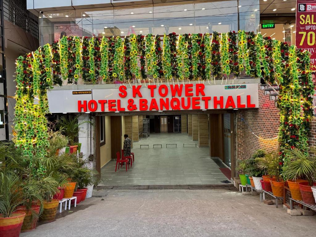 a building with a sign that reads six tower hotel and banquet hall at S K Tower Hotels in Nawāda