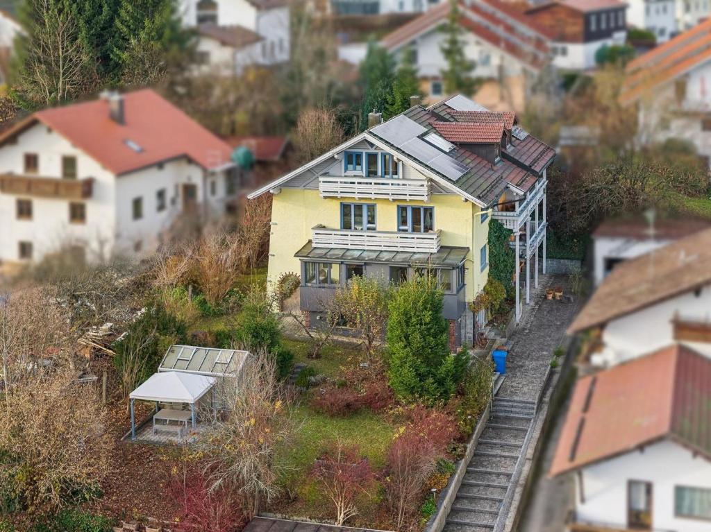 a model of a house on a hill with houses at Haus Farbenklang in Zwiesel