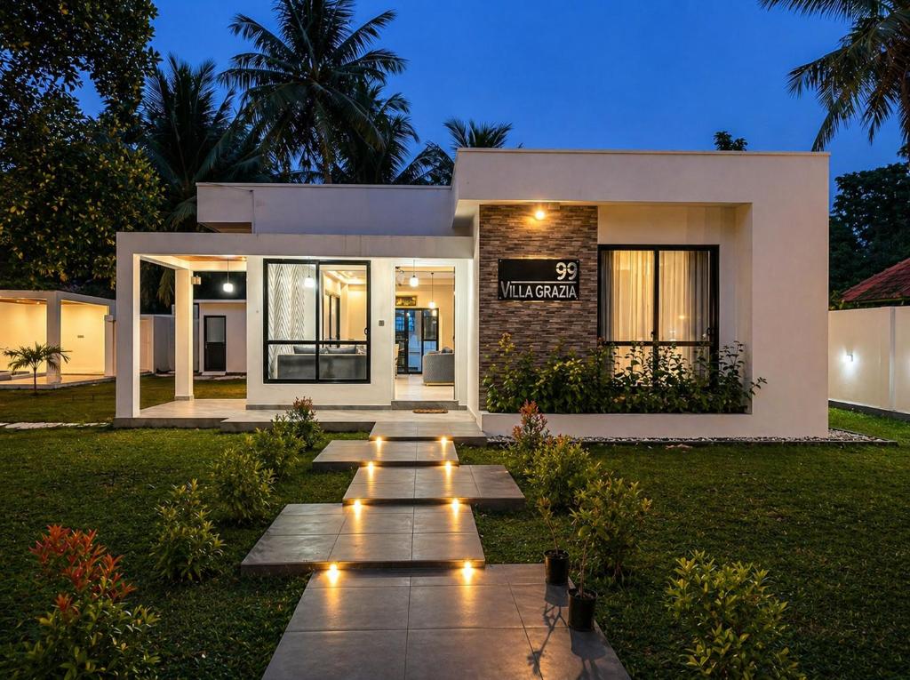 a house with lights in front of it at Villa Grazia 99 in Katuneriya