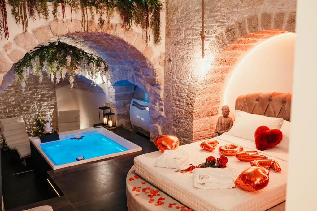 a room with a bed and a swimming pool at Moira Suite in Bitonto