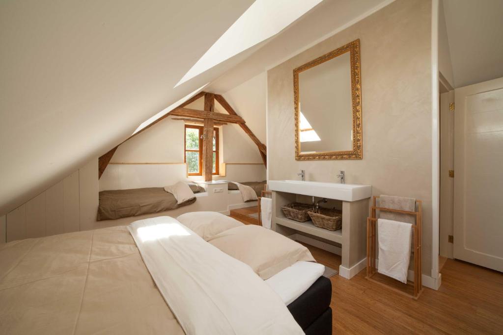 Postel nebo postele na pokoji v ubytování Maison Cimarron