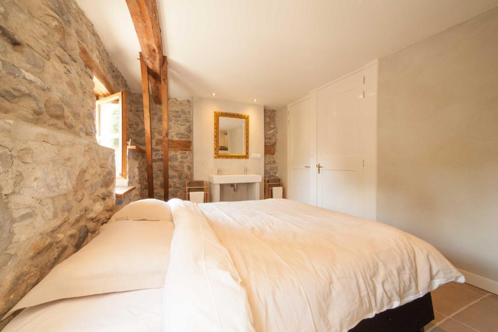Postel nebo postele na pokoji v ubytování Maison Cimarron
