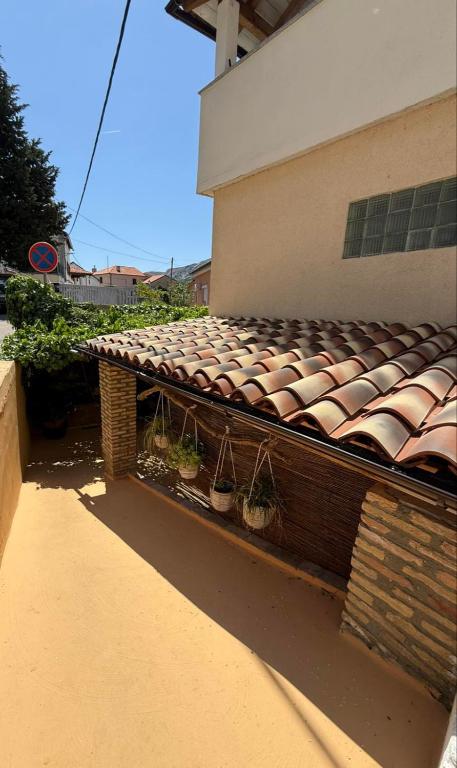a roof of a building with potted plants on it at Apartments Rome in Baška