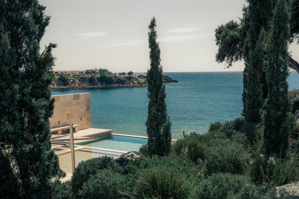 a house with a view of the water at Dia Dyo Residences in Pefki