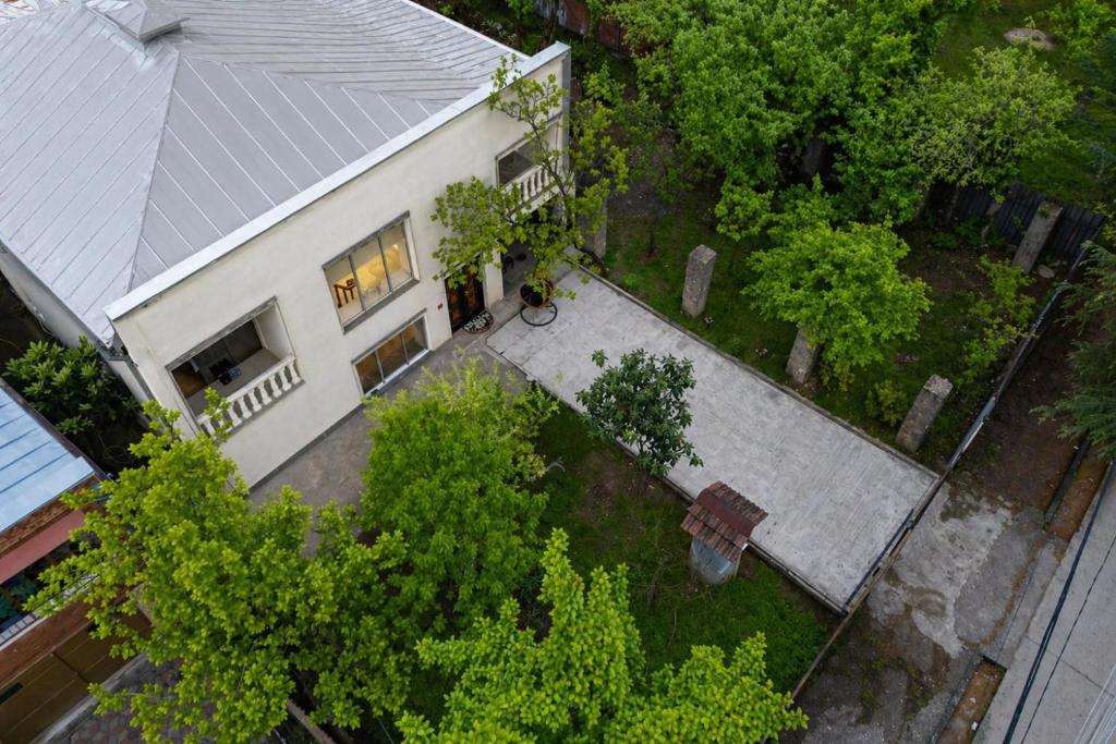an overhead view of a white house with a roof at Hotel Elemtega Kutaisi in Kutaisi