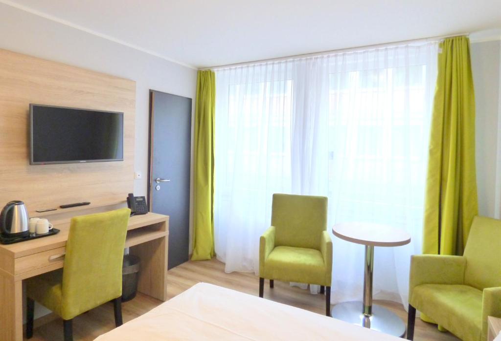 TV a/nebo společenská místnost v ubytování Minx – CityHotels