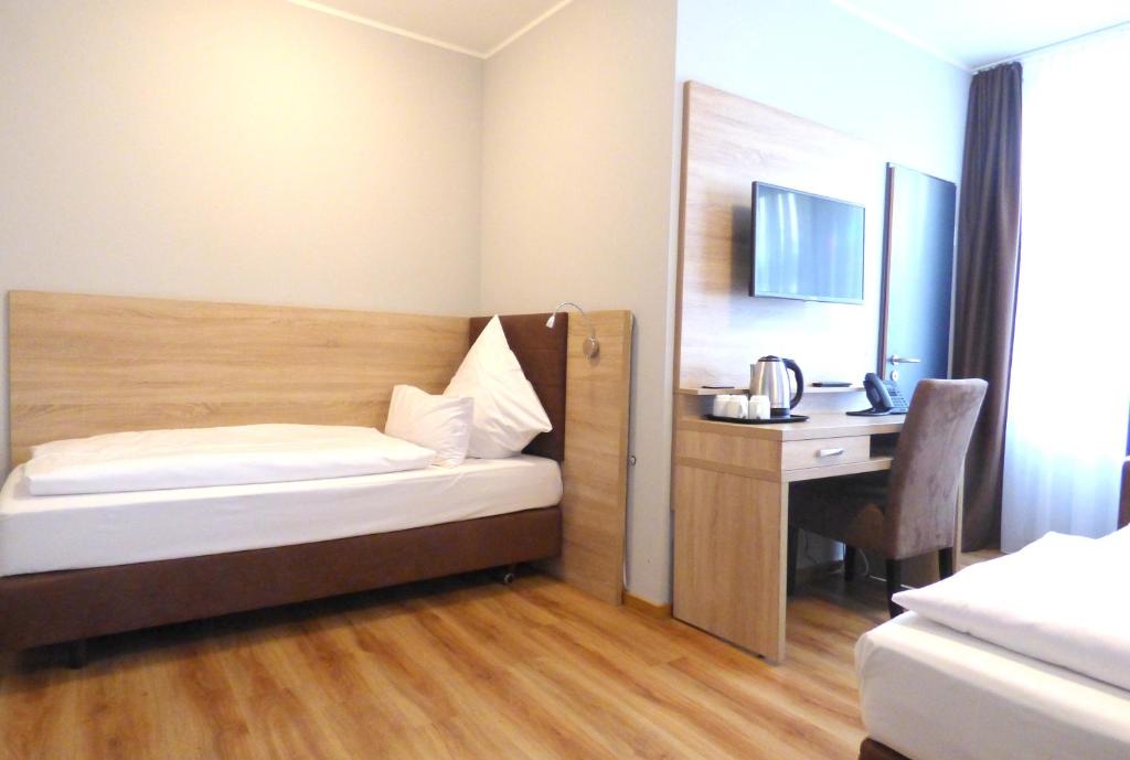 Postel nebo postele na pokoji v ubytování Minx – CityHotels