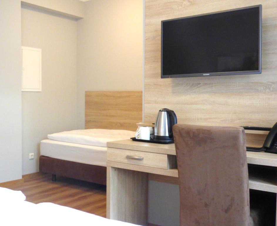 TV a/nebo společenská místnost v ubytování Minx – CityHotels