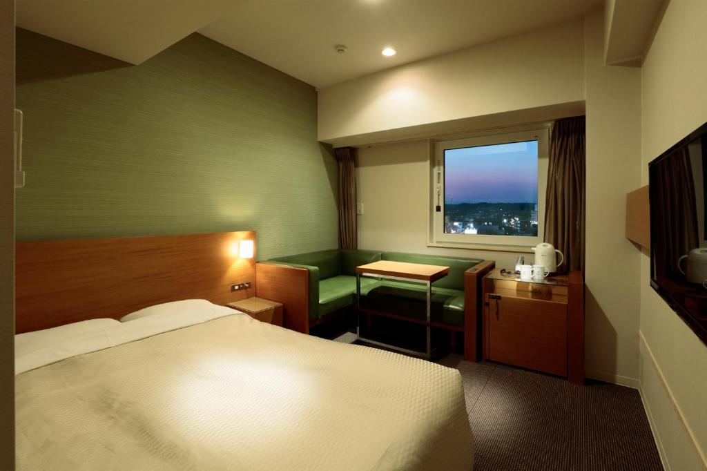 Postel nebo postele na pokoji v ubytování Candeo Hotels Handa