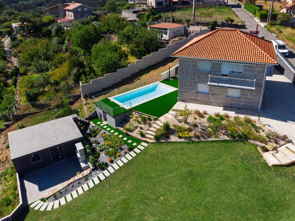 an aerial view of a house with a swimming pool at Casa Ona in Pontevedra