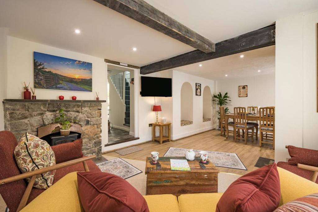 a living room with a couch and a fireplace at 2 Bed in Kingsteignton oc-w34194 in Kingsteignton