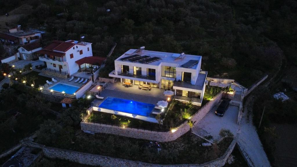 an aerial view of a mansion at night at Vila Palma in Berat