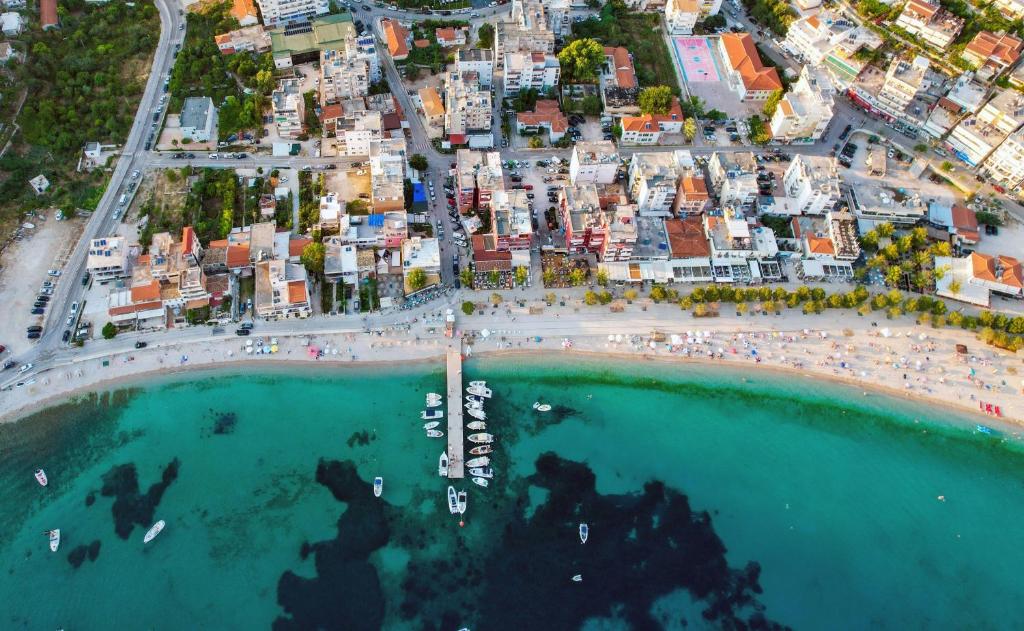 an aerial view of a beach and a city at Athena's & Kosta's Rooms Himara in Himare