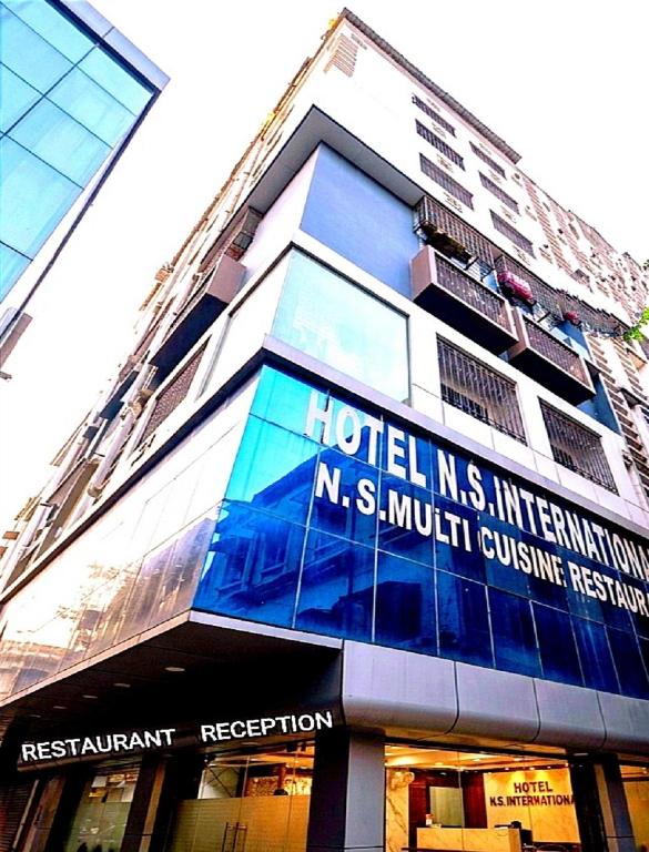 a building with a sign on the side of it at N S International in Kolkata