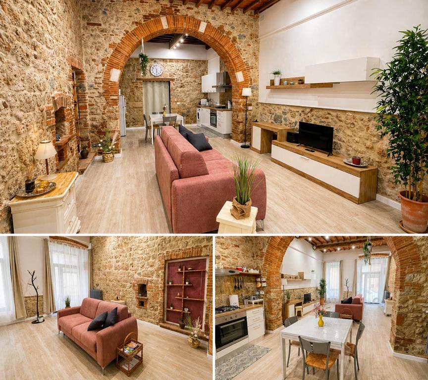a living room and dining room with a brick wall at La Casina del Corso in Massa Marittima
