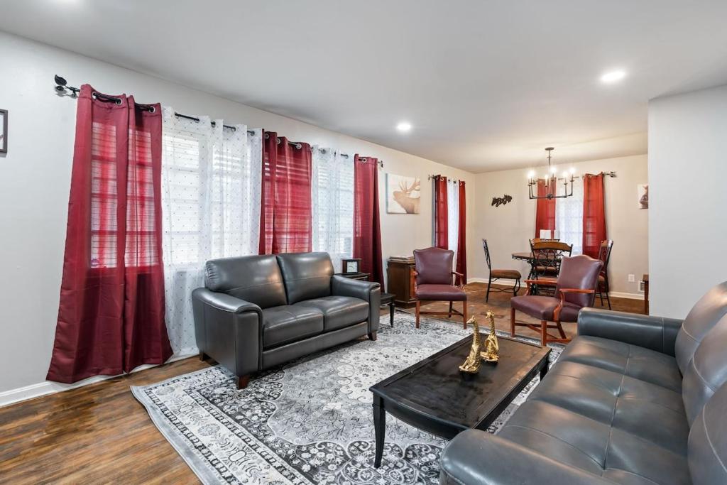 a living room with a couch and chairs and a table at Nostalgic In Norwood in Birmingham