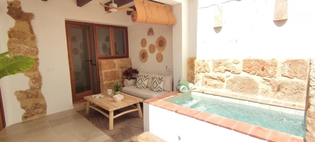 a bathroom with a jacuzzi tub in a house at Ca La Portella in Jávea