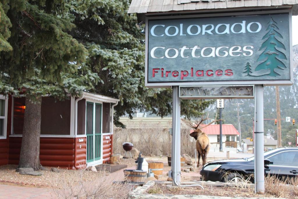 a sign for a colordoco coffees and a sign for a fire department at Colorado Cottages in Estes Park