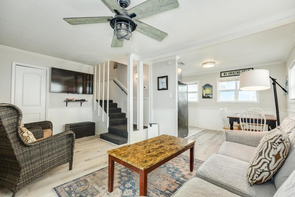 a living room with a couch and a table at Beachfront - Private Walkover to Beach in Surfside Beach