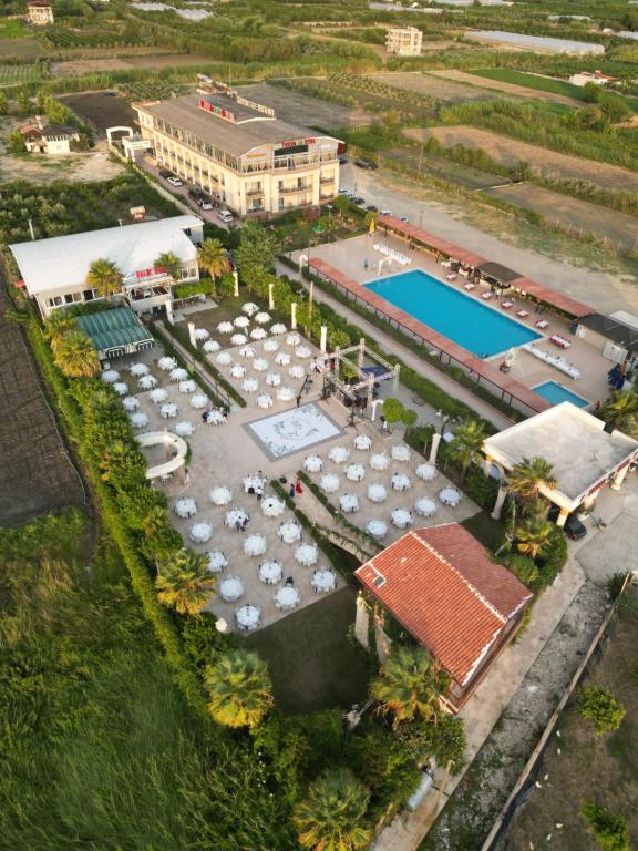 an aerial view of a resort with a pool and tables at TRUVA LİFE OTEl in Samandağı