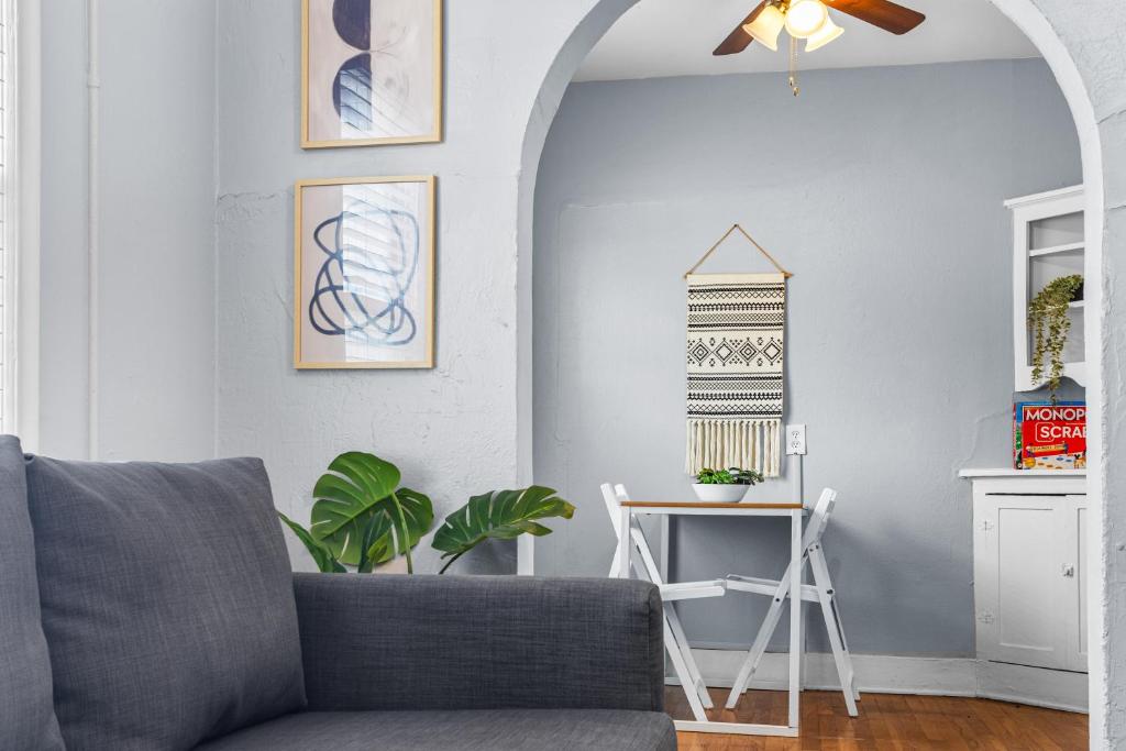 a living room with a couch and a table at Natural Sabbatical 1 Bedroom Apartment in Dallas