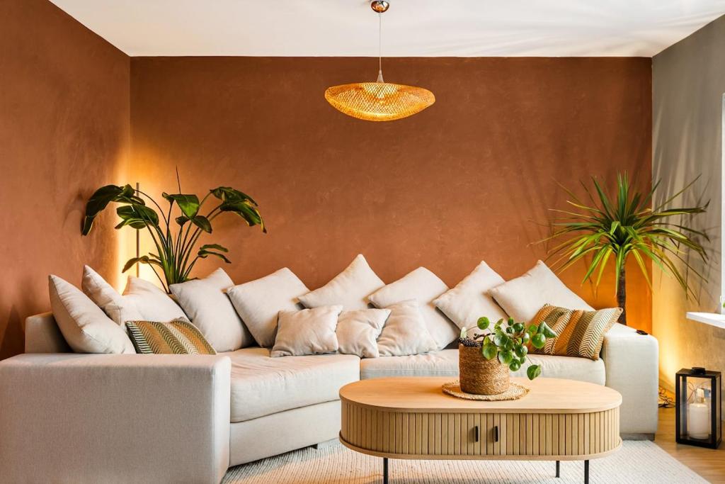 a living room with a white couch and a table at Casa Formentera in Molde