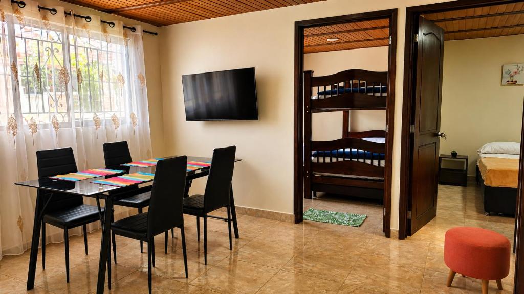 a dining room with a table and chairs at Salento verde in Salento