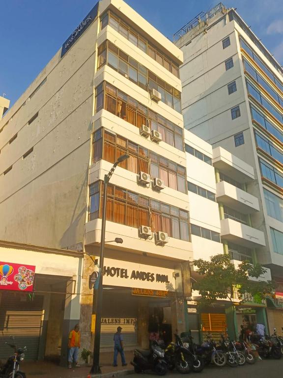 a tall building with motorcycles parked in front of it at Hotel Los Andes Inn in Guayaquil