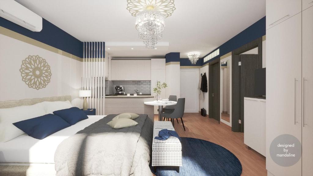 a bedroom with a large bed and a kitchen at Monarchia Apartman Sunny in Mosonmagyaróvár