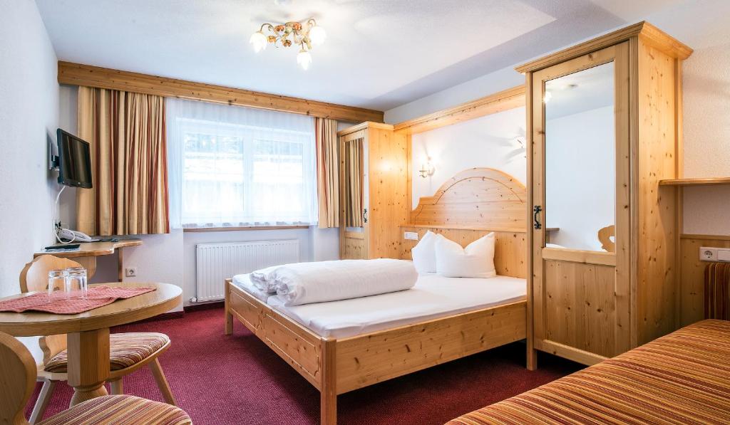 Postel nebo postele na pokoji v ubytování Apart Garni Elfrieda