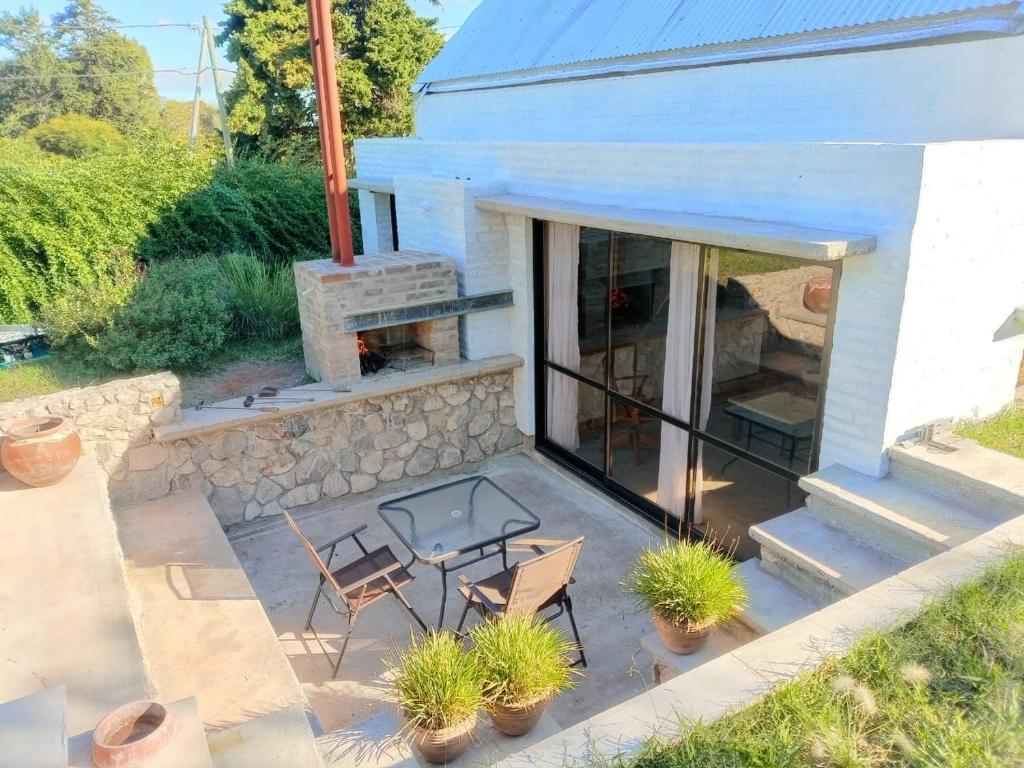 an aerial view of a patio with a fireplace at La Choza - Refugio para dos in La Falda