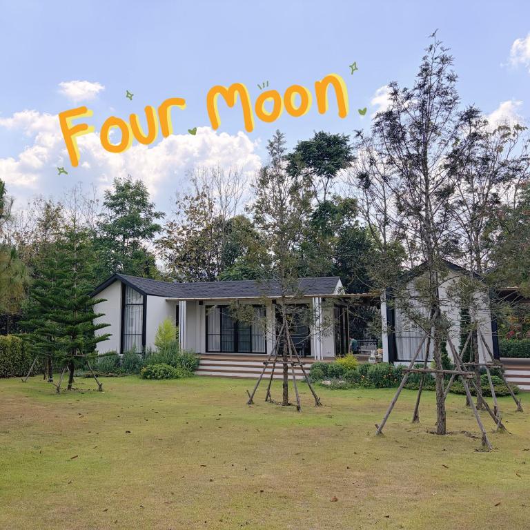 a house with two swings in front of a yard at Four Moon Khaoyai in Pong Talong