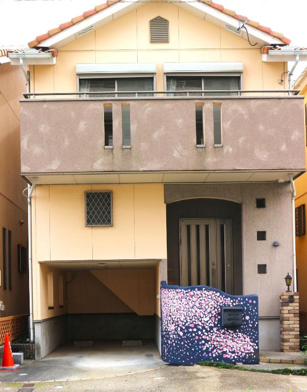 a building with a large object in front of it at Sakuraya 亀島店 in Nagoya