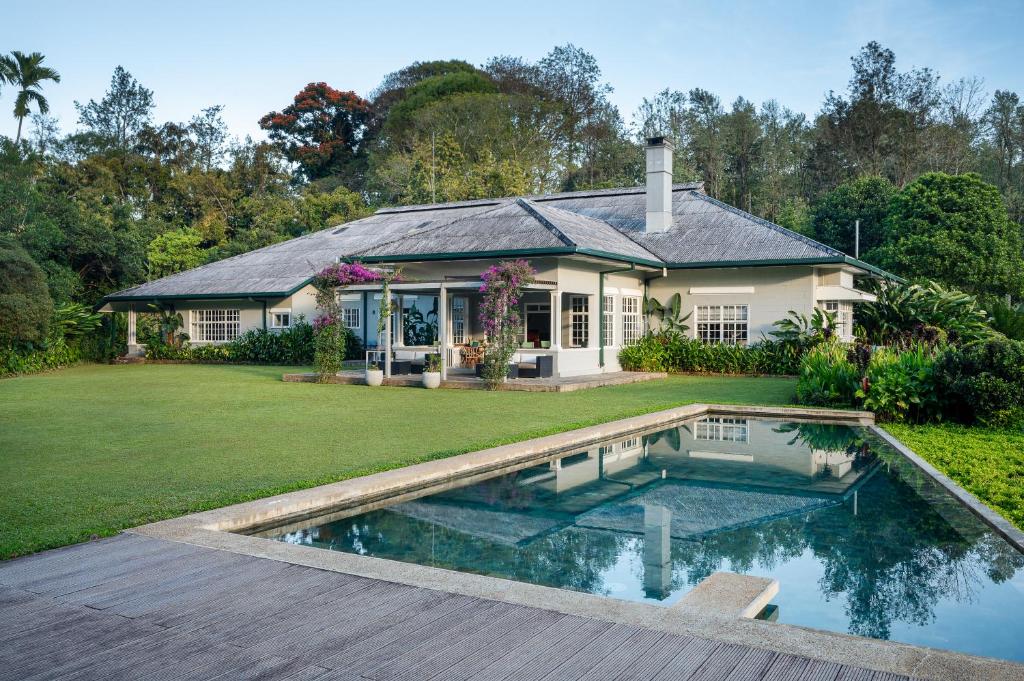 a house with a swimming pool in the yard at Nine Skies By Teardrop Hotels in Ella