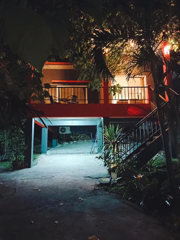 a house at night with a staircase leading to it at Elevated Bungalow House 5 min from the beach 3-6 in Nathon Bay