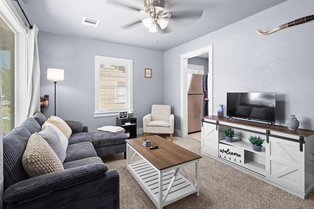 a living room with a couch and a tv at YeeHaw BnB in Amarillo