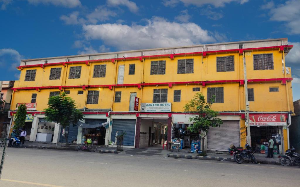 a yellow building on the side of a street at Aanand Hotel in Janakpur