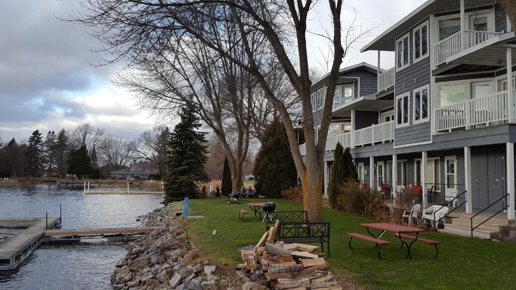 a house next to a body of water next to a house at Snug Harbor Inn in Sturgeon Bay