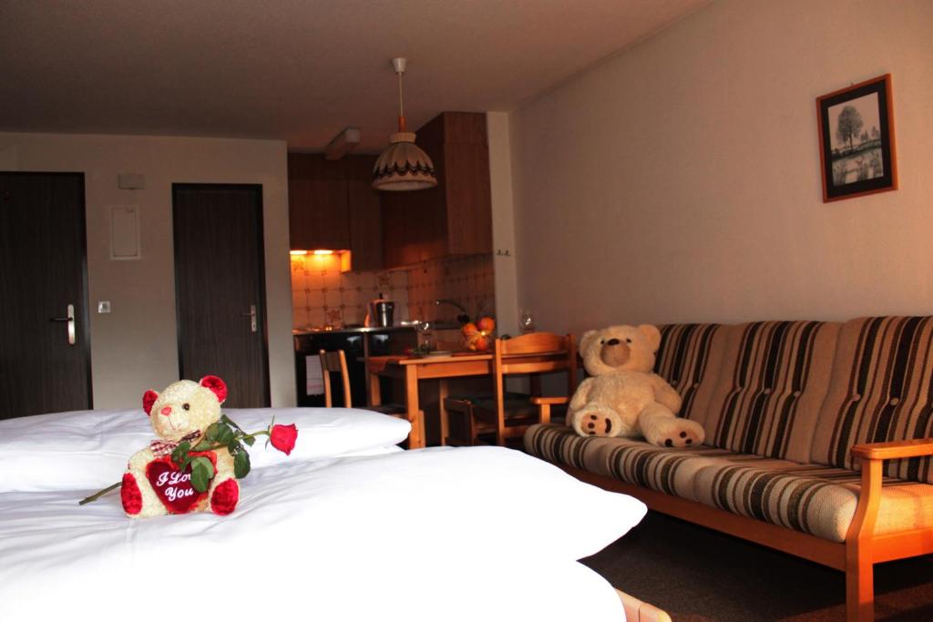 Postel nebo postele na pokoji v ubytování Appartements Monte Rosa