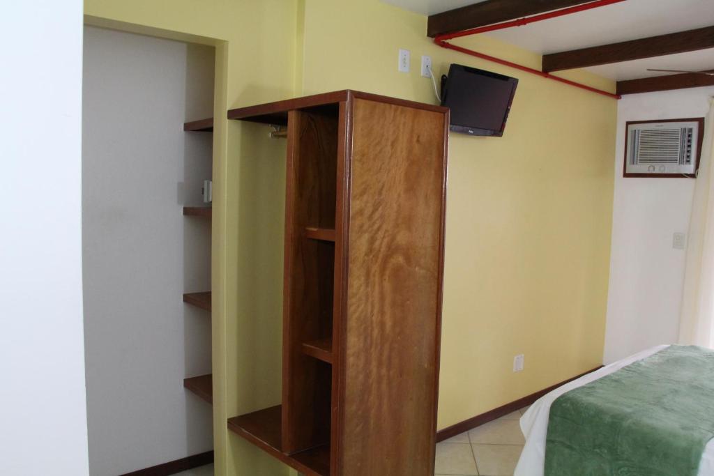 Cama ou camas em um quarto em Pousada Solar das Tartarugas