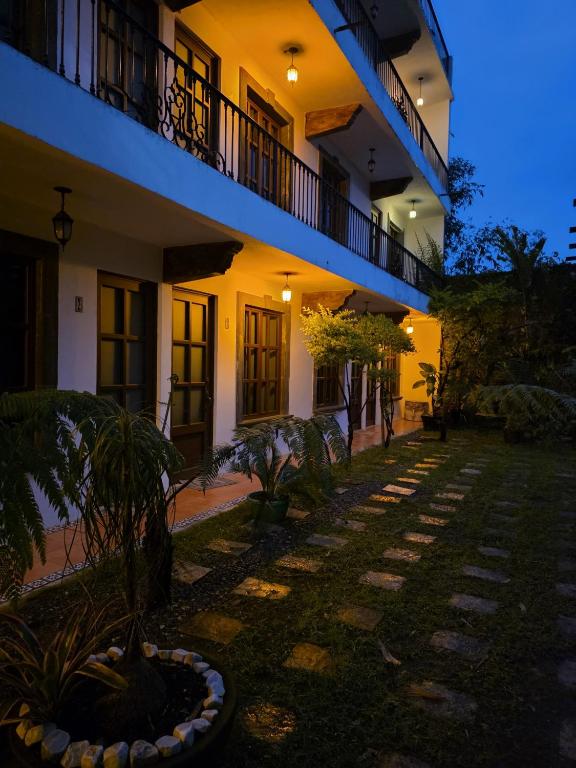 an empty courtyard of a building at night at Hotel Magnolia cuetzalan in Cuetzalán del Progreso