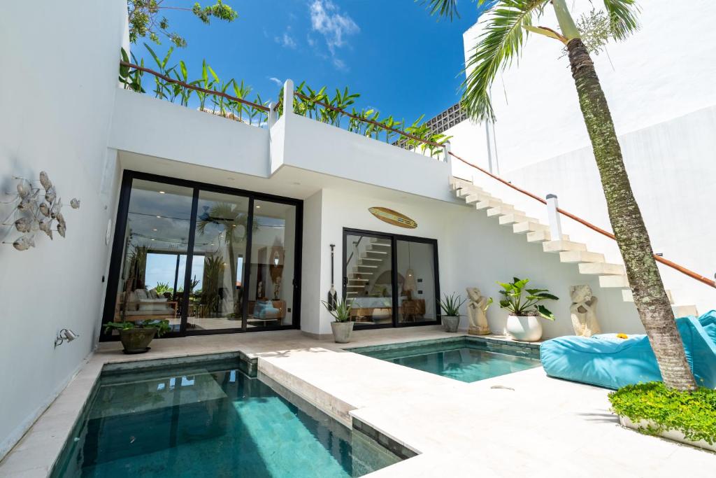 an image of a villa with a swimming pool at Villa Sawahku - 2BR Private Villa with Rooftop & Rice Field View in Canggu