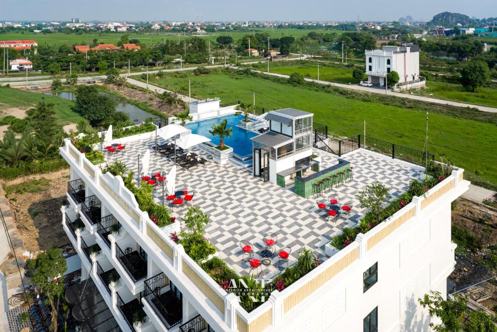 an aerial view of a building with a swimming pool at SaLa Tam Coc Hotel & Spa in Ninh Binh